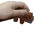 a pixel art of a hand holding a block of wood .