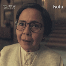 an advertisement for nine perfect strangers shows an older woman wearing glasses