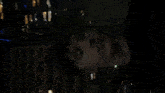 a blurry picture of a building with a green arrow pointing to the left