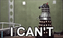 a dalek robot is standing in front of a sign that says i can t