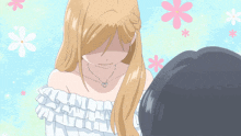 a girl wearing a necklace with a heart on it