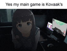 a girl is standing in front of a computer screen with the words yes my main game is kovaak 's