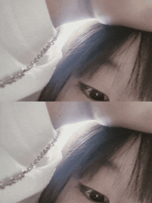 a close up of a person 's face with a white shirt