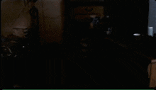 a blurry picture of a person in a dark room with a green border