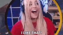 a woman wearing headphones is laughing and saying i like that