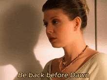 a woman with the words be back before dawn written above her