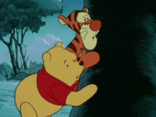 winnie the pooh and tigger are climbing a tree together