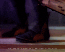 a book is laying on the floor with the words virtual foto division a misthios in training