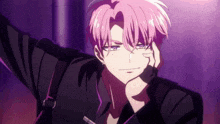a man with pink hair and a black shirt is looking at the camera