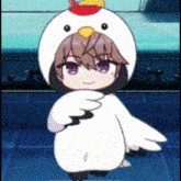 a girl in a chicken costume is dancing .