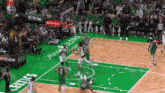 a basketball game is being played on a court with a coinbase ad