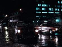 a silver car is parked in front of a building that says abc