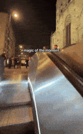 a picture of an escalator with the words magic of the moment above it