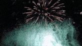 a fireworks display in the night sky with smoke coming out of it