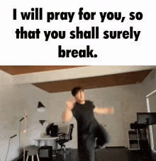 a man in a black shirt is jumping in the air with the words " i will pray for you so that you shall surely break "