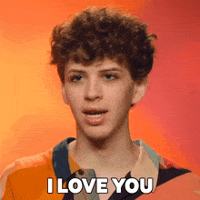 a young man with curly hair is saying " i love you "