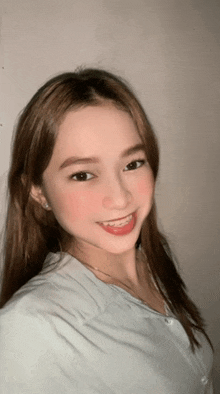 a woman with braces on her teeth is smiling for the camera