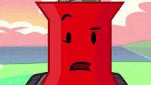 a red object with a sad face on it 's face