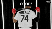 a baseball player is holding a bat over his shoulder and wearing a jersey with the number 74 on it .