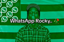 a man in a plaid shirt stands in front of a green and white striped background with the words whatsapp rocky