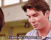 a man is talking to another man and says it 's good luck it 'll protect you .