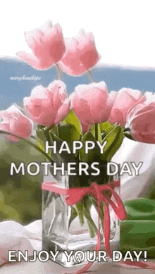 a vase filled with pink flowers and the words `` happy mother 's day enjoy your day ! ''