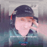 a man wearing a batman hat and headphones says " in this life i was loved by you thank you "
