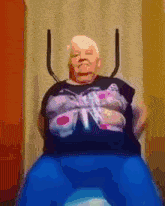 a woman wearing a black shirt with a butterfly on it is sitting on a chair