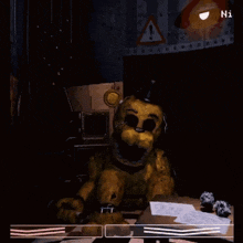 a couple of teddy bears are standing next to each other in a dark room