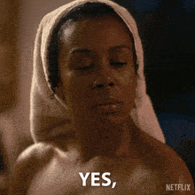 a woman with a towel on her head says yes
