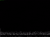 a frog is dancing on a stage in front of spotlights