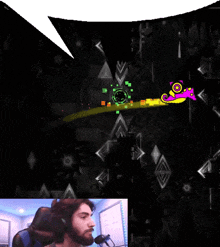 a man playing a video game with a speech bubble above his head