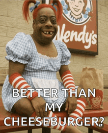 a wendy 's sign is behind a woman in a wendy 's outfit