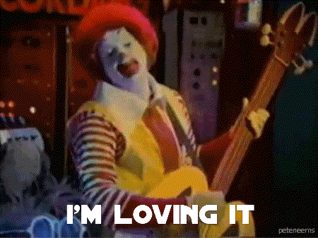 mcdonald 's clown playing a guitar with the words i 'm loving it below him
