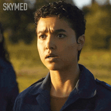 a close up of a person 's face with the word skymed behind them