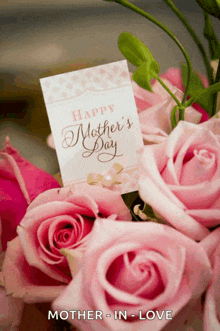 a bouquet of pink roses with a card that says happy mother 's day on it