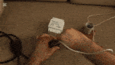 a person is plugging wires into a capacitor that says cap cut