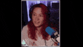 a girl with red hair is wearing headphones and a white shirt that says ' calvin klein ' on it