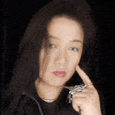 a woman with a silver ring on her finger