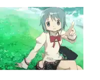 a girl with blue hair is sitting in the grass giving a thumbs up sign .
