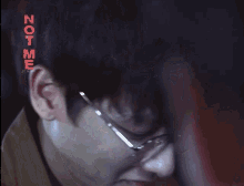 a close up of a person 's face with the words not me on the bottom right