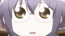 a close up of a girl 's face with glasses