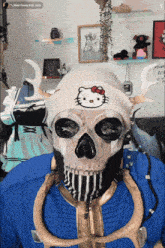 a skeleton wearing a hello kitty hat and a vault boy outfit