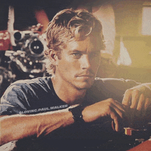 a close up of a man 's face with loving paul walker written on the bottom