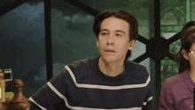 a man in a striped sweater says whatcha sniffin on boy