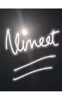 a lighted sign that says ' satnam ' on it