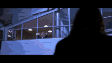 a woman stands on a balcony in a dark room