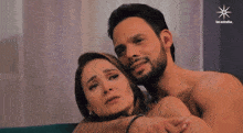 a man without a shirt kisses a woman on the forehead with the words las estrellas in the corner