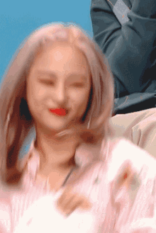 a blurry picture of a woman 's face with her eyes closed