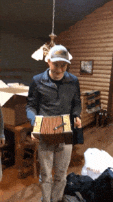 a man holding an accordion wearing a hat that says nike on it